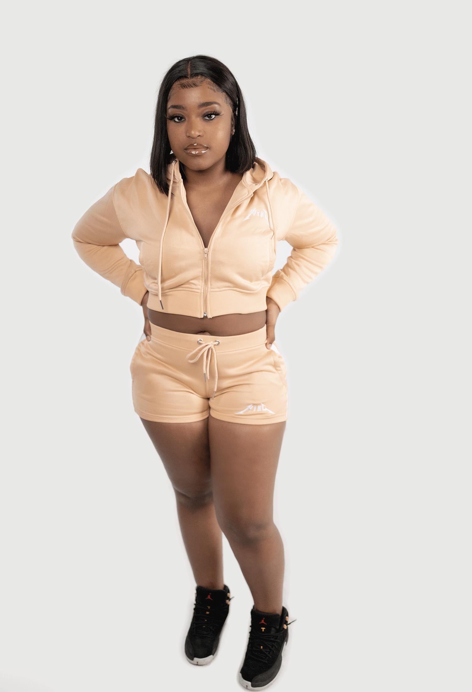 FEMALE MODEL WEARING SIZE L NUDE TRACKSUIT