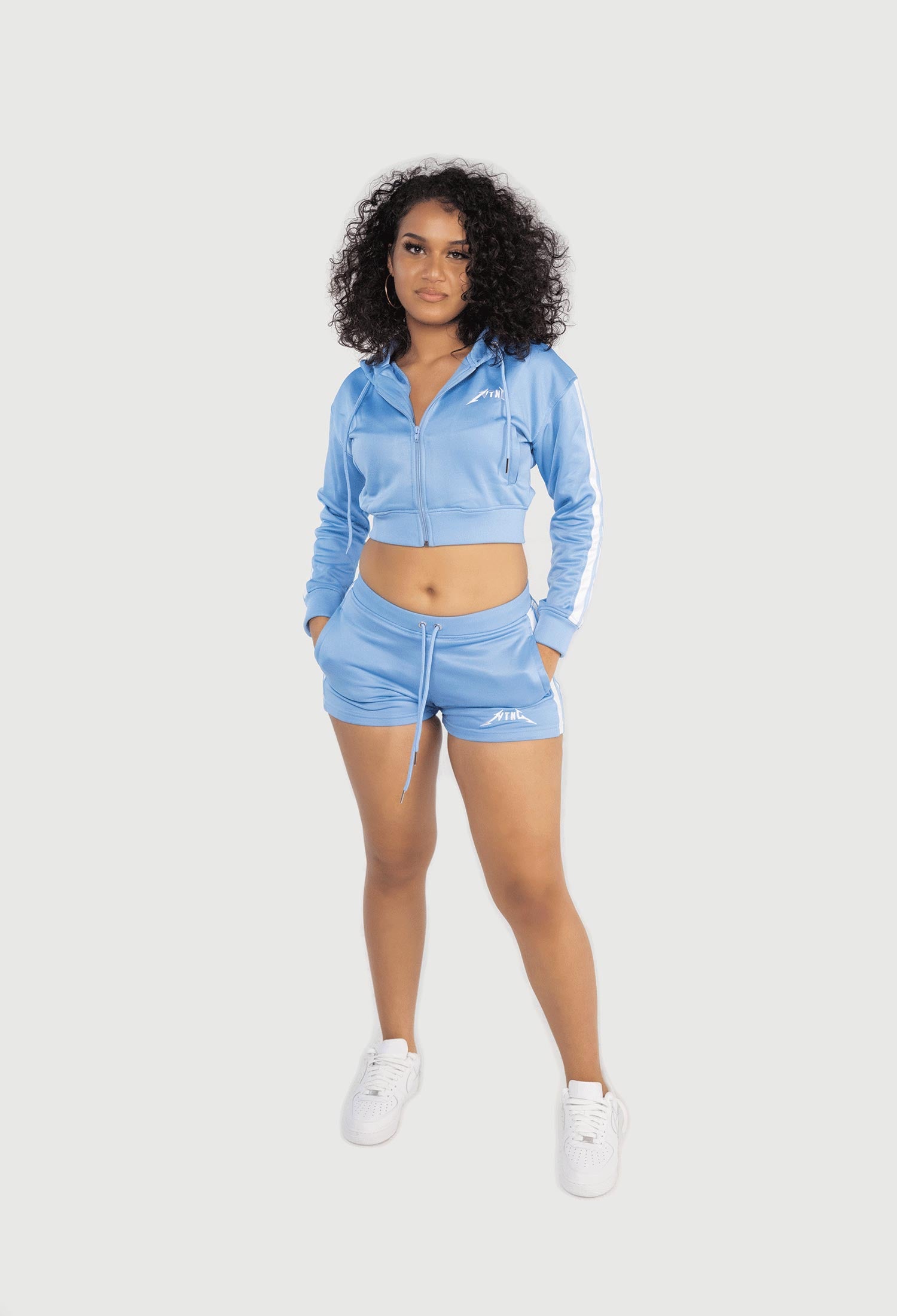 FEMALE MODEL WEARING SIZE M SKY BLUE TRACKSUIT